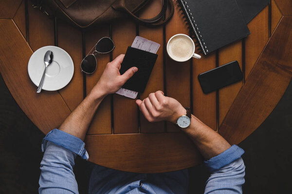 man with passport and air ticket 