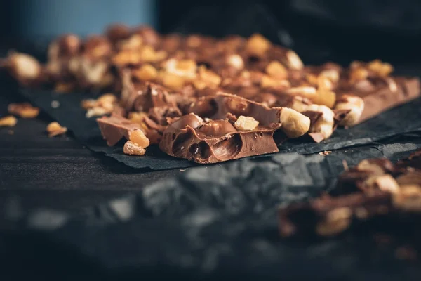 Milk chocolate with nuts pieces — Free Stock Photo