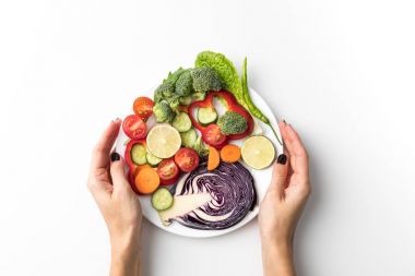 woman holding plate with salad clipart