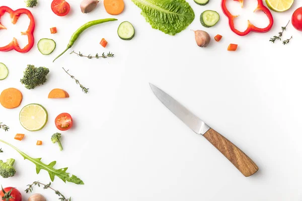 Knife with vegetables — Stock Photo, Image