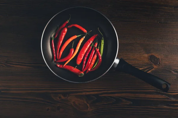 Pan with red chili peppers — Stock Photo, Image