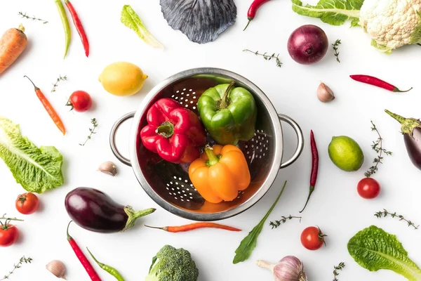Colander with colored bell peppers — Stock Image Colander with colored bell peppers Royalty Free Stock Images