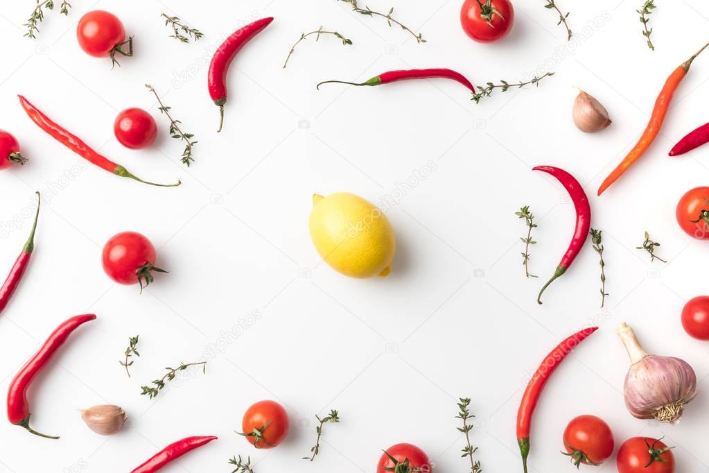 lemon among chili peppers and tomatoes 