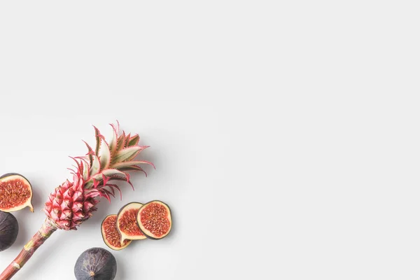 Pink pineapple with figs — Stock Photo, Image