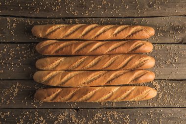 baguettes and grains on table clipart