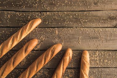 baguettes and grains on table clipart