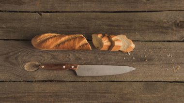 sliced baguette and knife  clipart