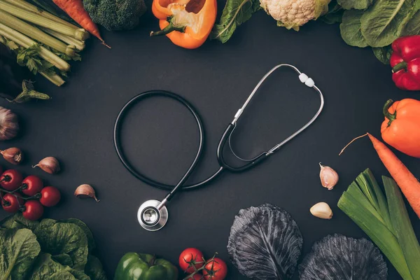 Top view of stethoscope among vegetables on gray table — Stock Image Top View Stethoscope Vegetables Gray Table Stock Photo