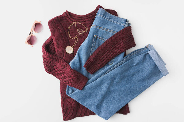 knitted sweater, trendy jeans and accessories