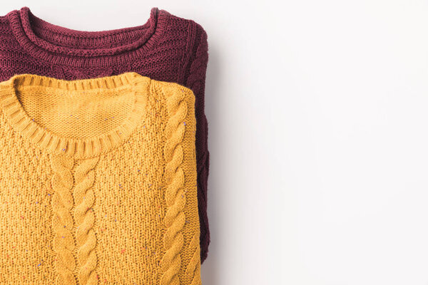 burgundy and yellow sweaters