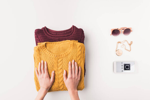 sweaters and smartphone with uber appliance