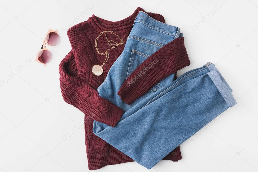 knitted sweater, trendy jeans and accessories
