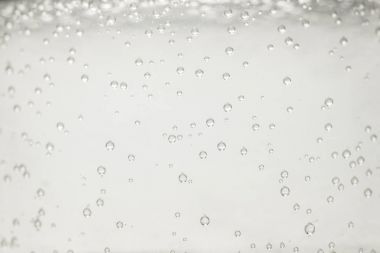 close up view of mineral water with bubbles