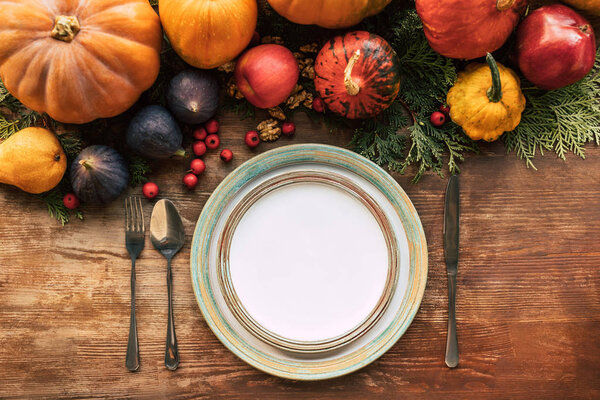 Top view of autumn  table setting with beautiful various fruits and vegetables