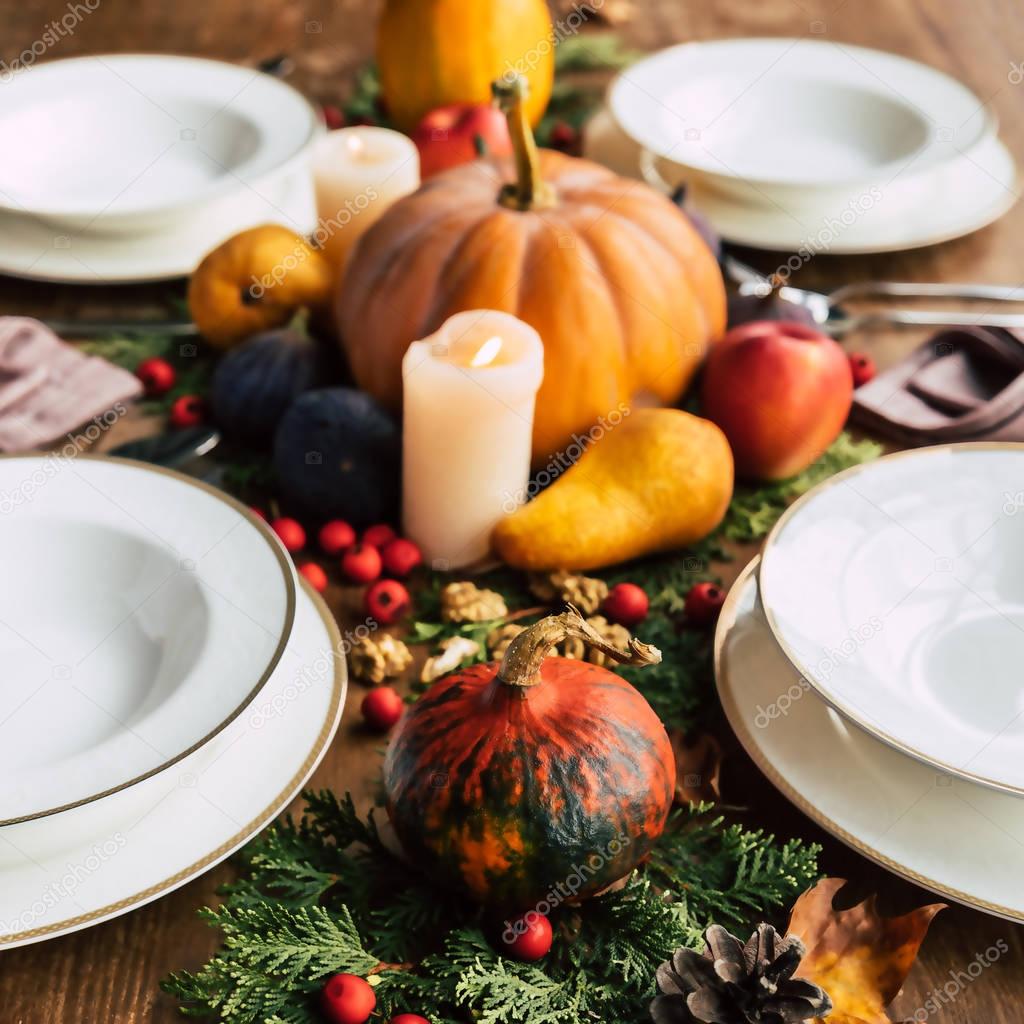 Close-up shot of table setting with beautiful fruits and vegetables autumn  decor