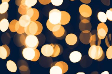 siyah zemin üzerine altın yuvarlak bokeh