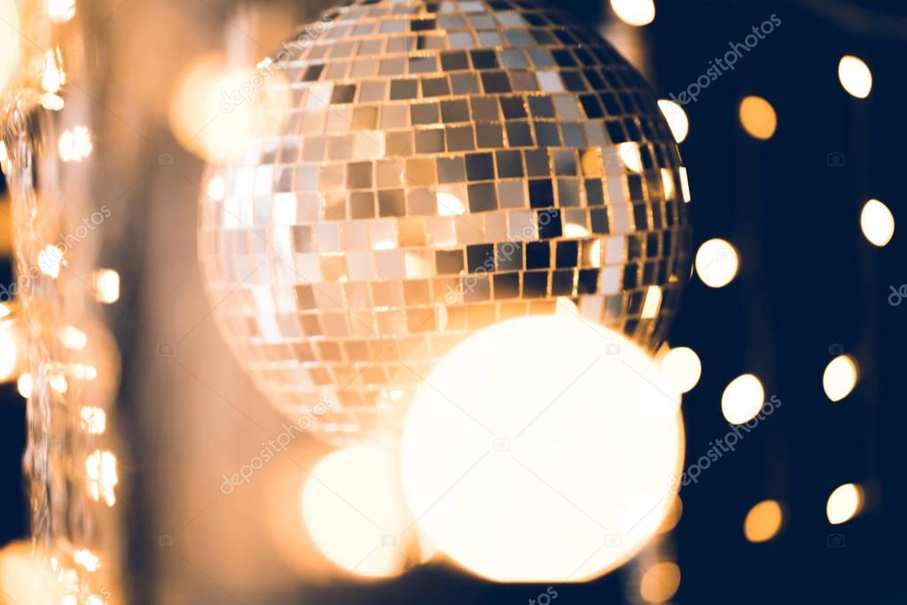 classic disco ball with christmas lights around