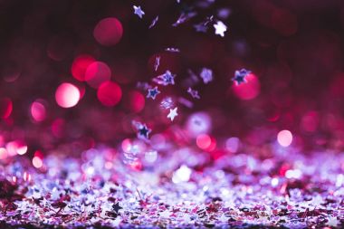 christmas texture with falling pink and silver shiny confetti stars clipart
