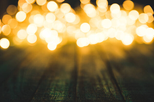 festive bokeh lights on wooden surface, christmas background