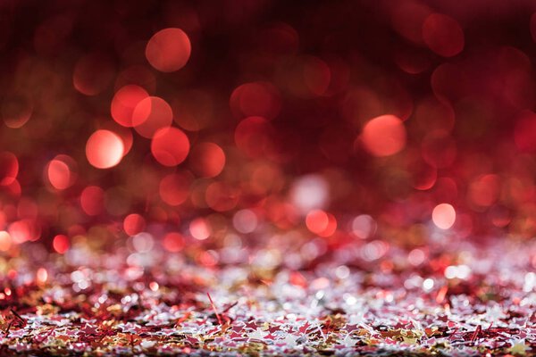 christmas background with red bright confetti stars