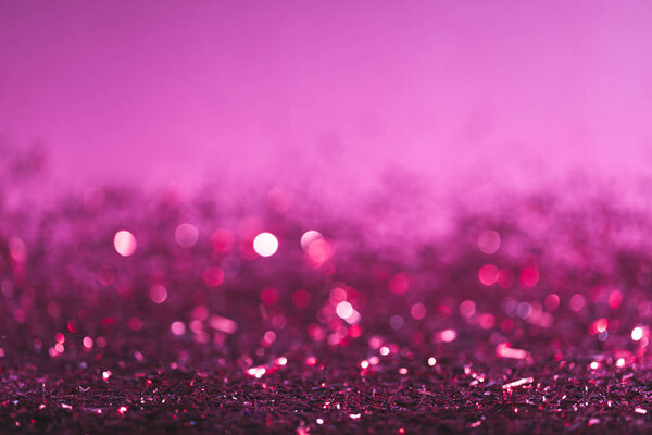 christmas background with pink and purple shiny confetti
