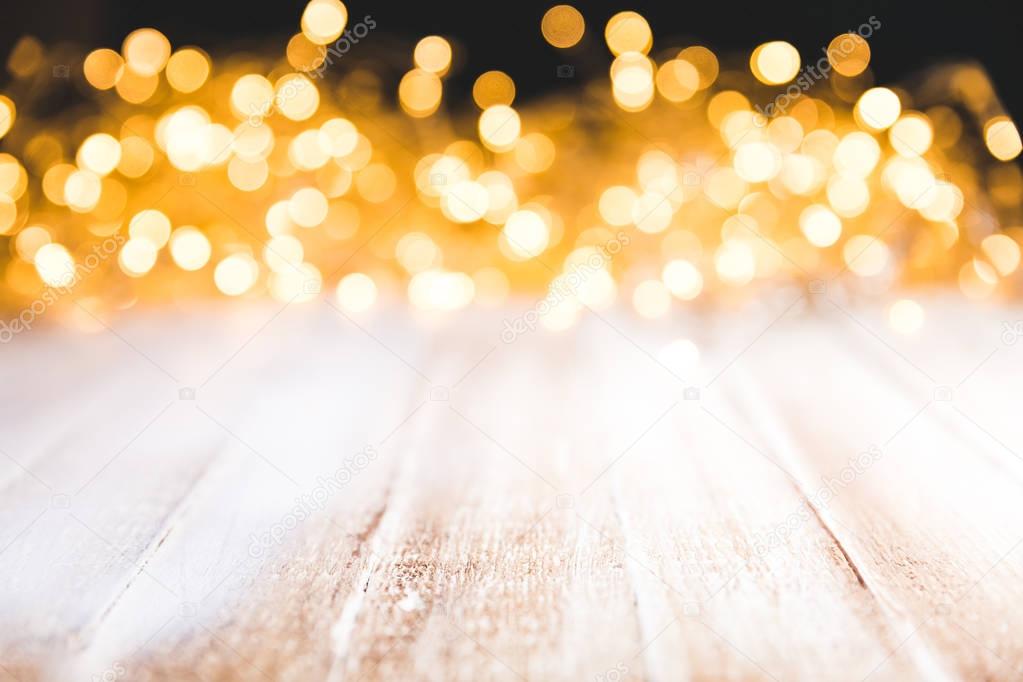 festive bokeh lights on wooden surface, christmas decor