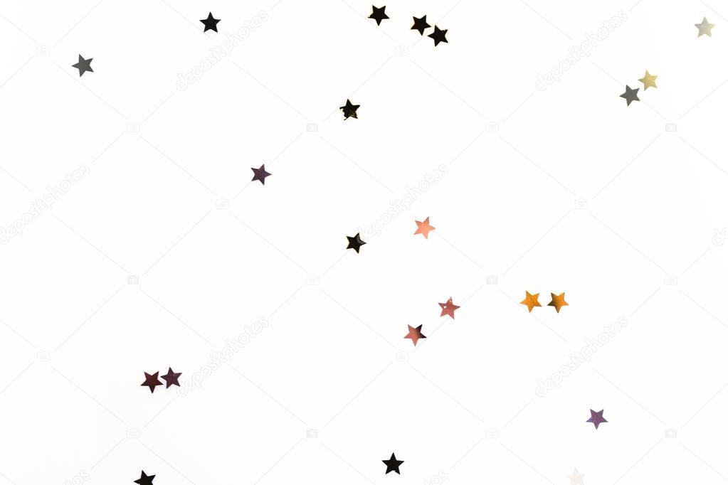 christmas golden confetti stars isolated on white background