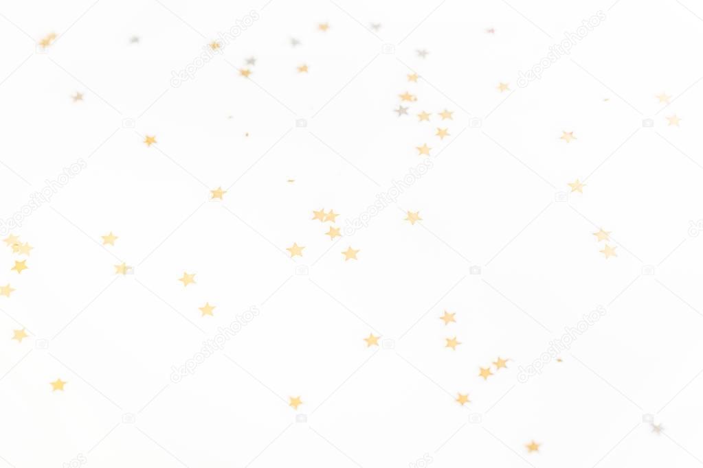 christmas golden confetti stars isolated on white background