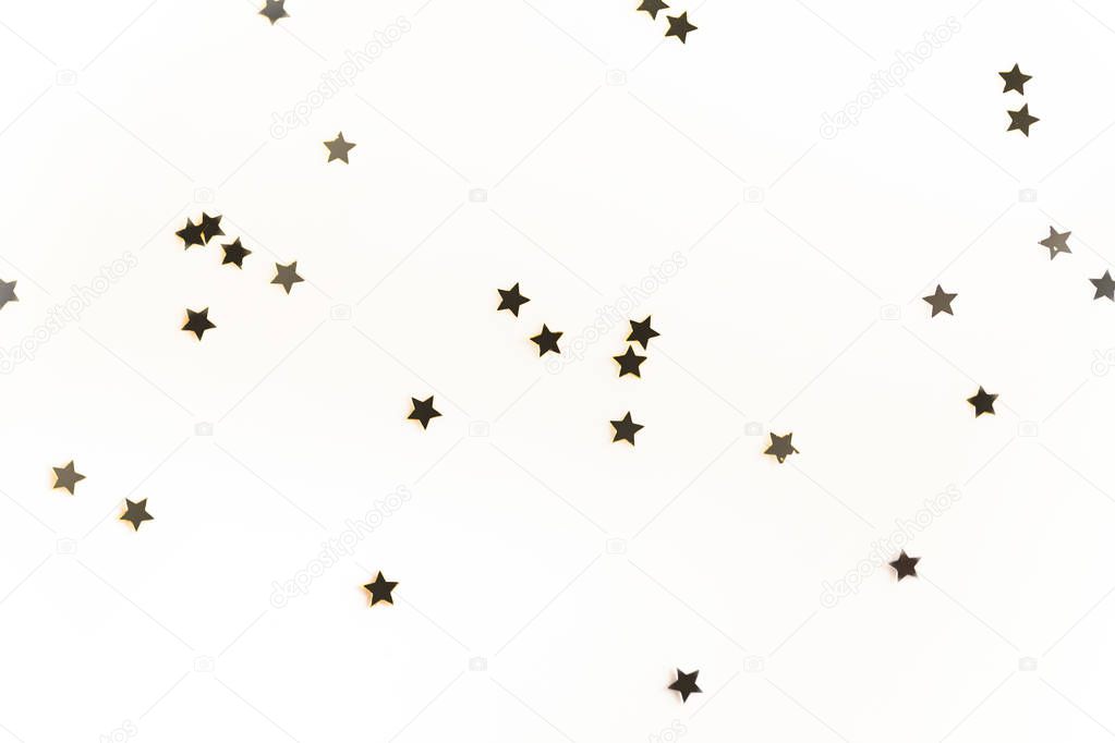 christmas golden confetti stars isolated on white background