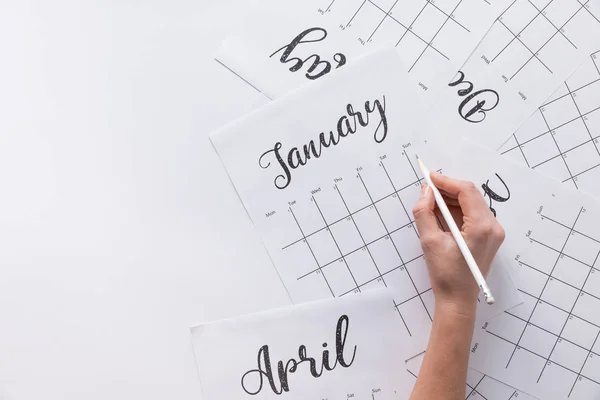 Teilansicht Einer Frau Die Notizen Kalender Macht Isoliert Auf Weiß — Stockfoto