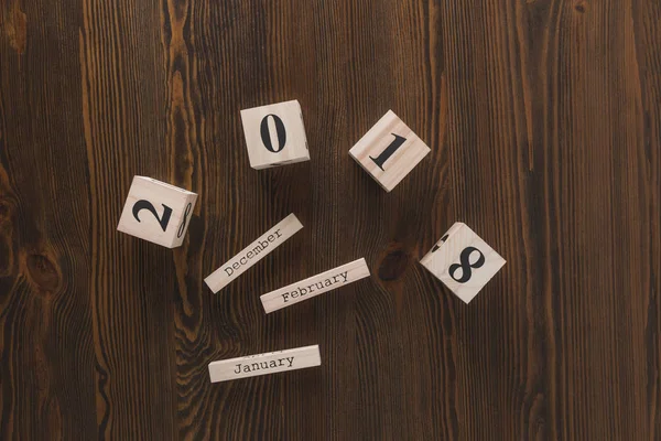 Top View Parts Wooden Calendar Dark Wooden Tabletop — Free Stock Photo