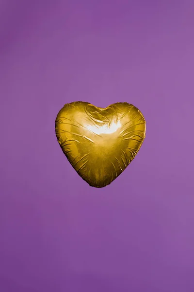 Heart Shaped Candy Golden Wrapper Isolated Purple — Free Stock Photo