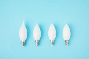 top view of different white lamps isolated on blue clipart