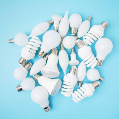 top view of different white lamps isolated on blue clipart