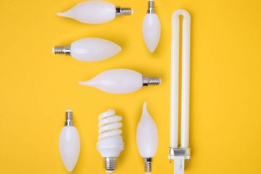 top view of set of various white lamps isolated on yellow clipart