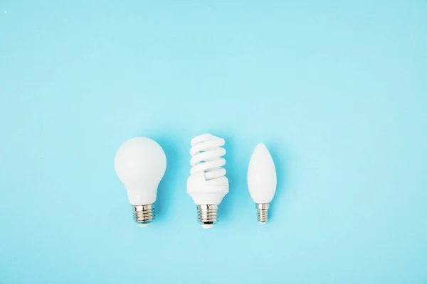 Top View Different White Lamps Isolated Blue — Stock Photo, Image