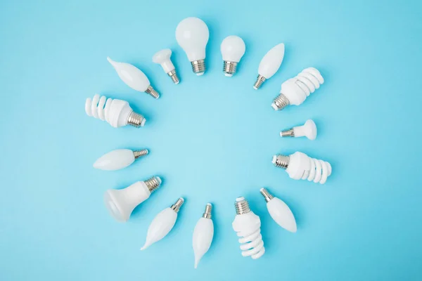 Top View Different White Lamps Arranged Circle Isolated Blue — Stock Photo, Image