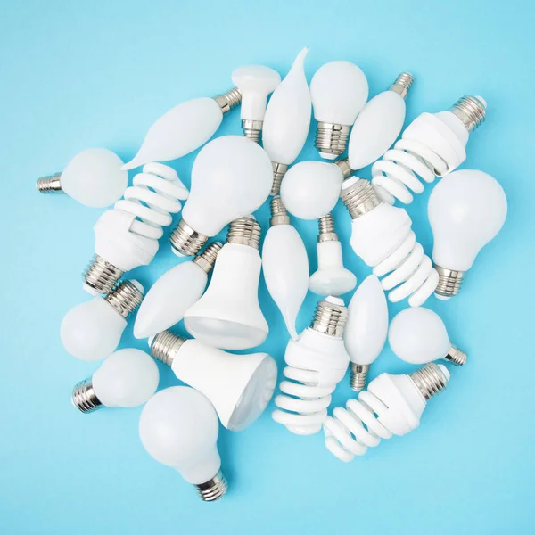 Top View Different White Lamps Isolated Blue — Stock Photo, Image