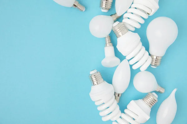 Top View Different White Lamps Isolated Blue — Stock Photo, Image