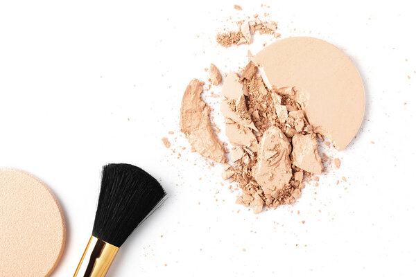 cracked cosmetic powder isolated on white