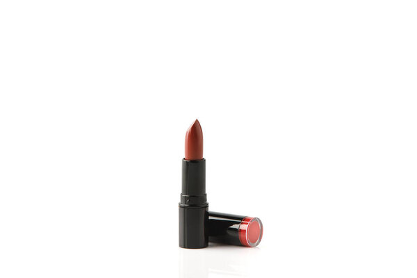 single tube of red lipstick isolated on white
