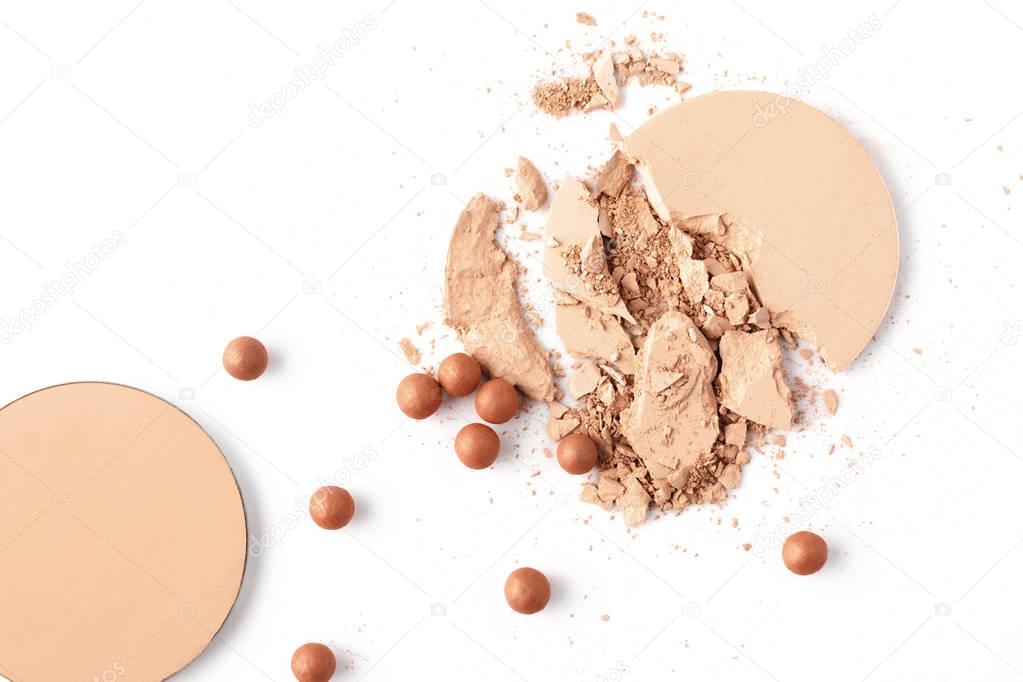 flat lay composition of nude cosmetic powder isolated on white
