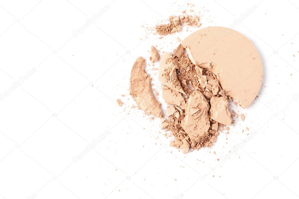 cracked circle of cosmetic powder isolated on white