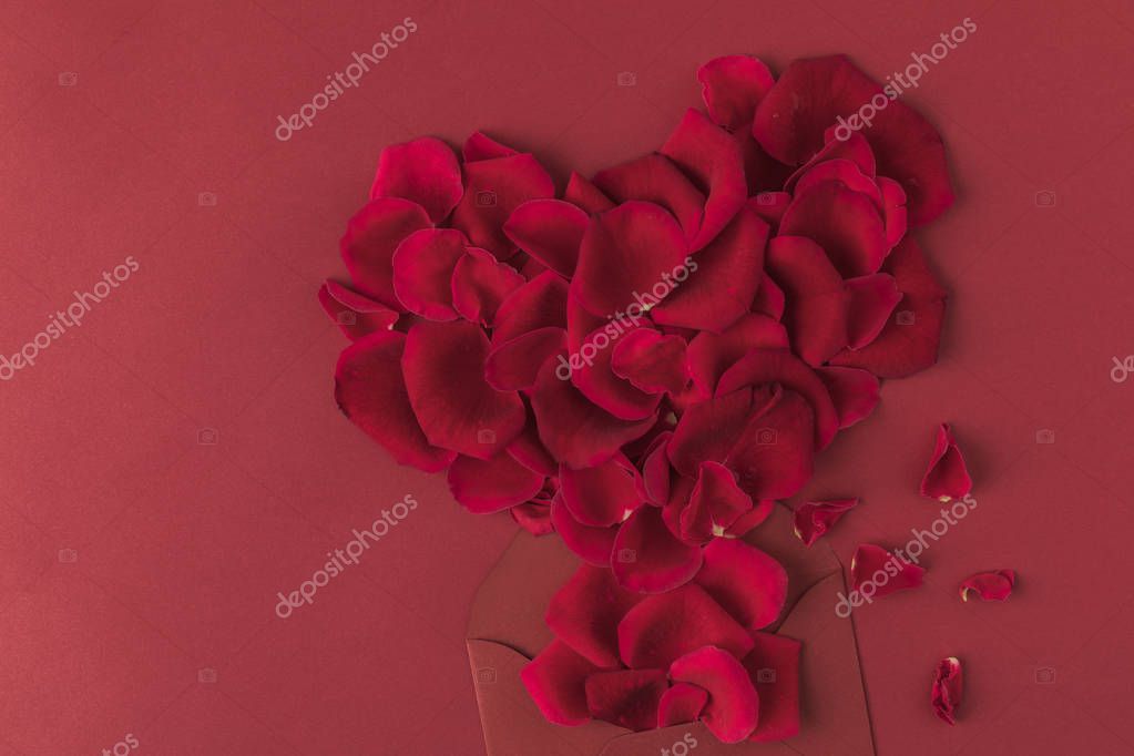 Top view of heart made of roses petals and envelope isolated on red, st valentines day concept stock vector