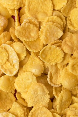 close-up full frame background from healthy crispy corn flakes  clipart