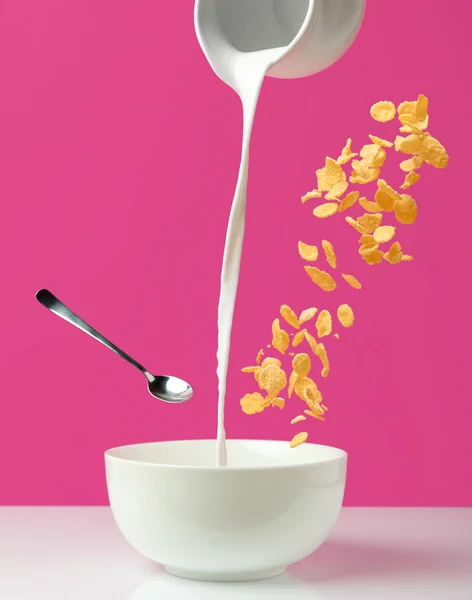 Pouring Fresh Healthy Milk Jug Bowl Spoon Corn Flakes Pink — Stock Photo, Image