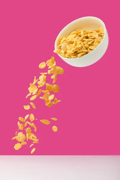 White Bowl Corn Flakes Pouring Out Pink — Stock Photo, Image