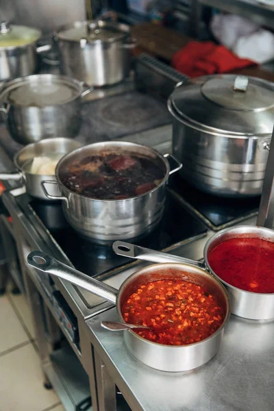 Various food in sauce pans at restaurant kitchen — Stock Image Various Food Sauce Pans Restaurant Kitchen Royalty Free Stock Images