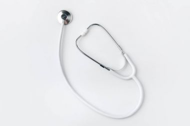 stethoscope laying isolated on white background    clipart