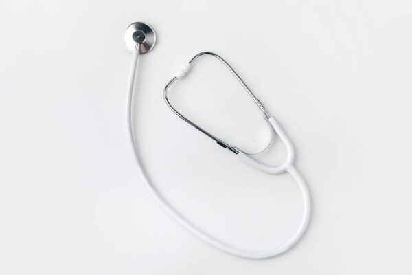 stethoscope laying isolated on white background   